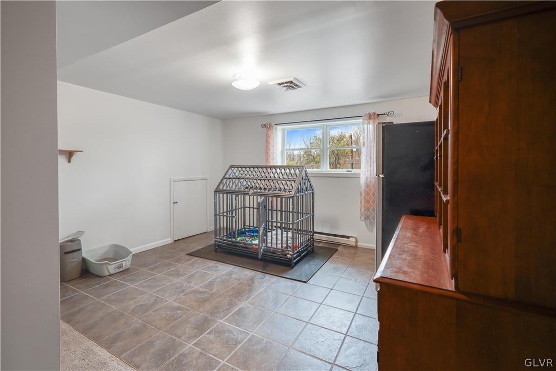 4585 Maple Drive Walnutport, PA 18088 - Photo 25 of 36 a room with a chair and white walls