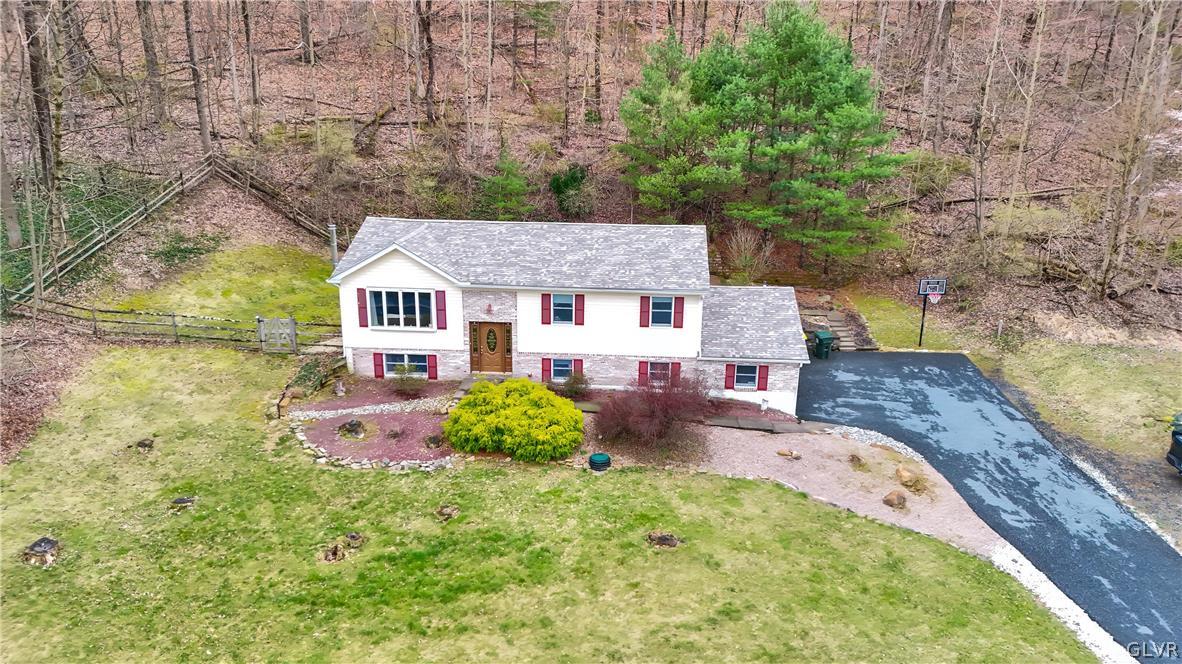 4585 Maple Drive Walnutport, PA 18088 - Photo 31 of 36 a aerial view of a house with table and chairs and wooden fence
