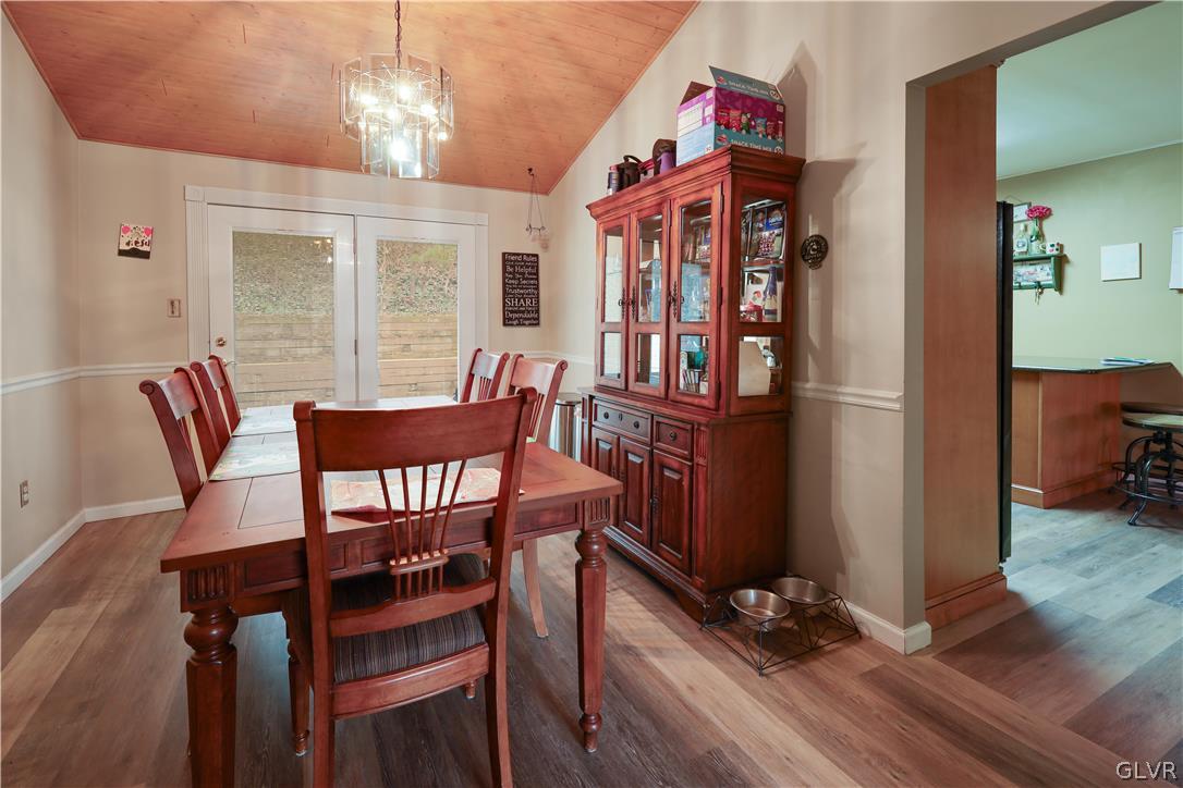 4585 Maple Drive Walnutport, PA 18088 - Photo 7 of 36 a view of a dining room with furniture wooden floor and chandelier