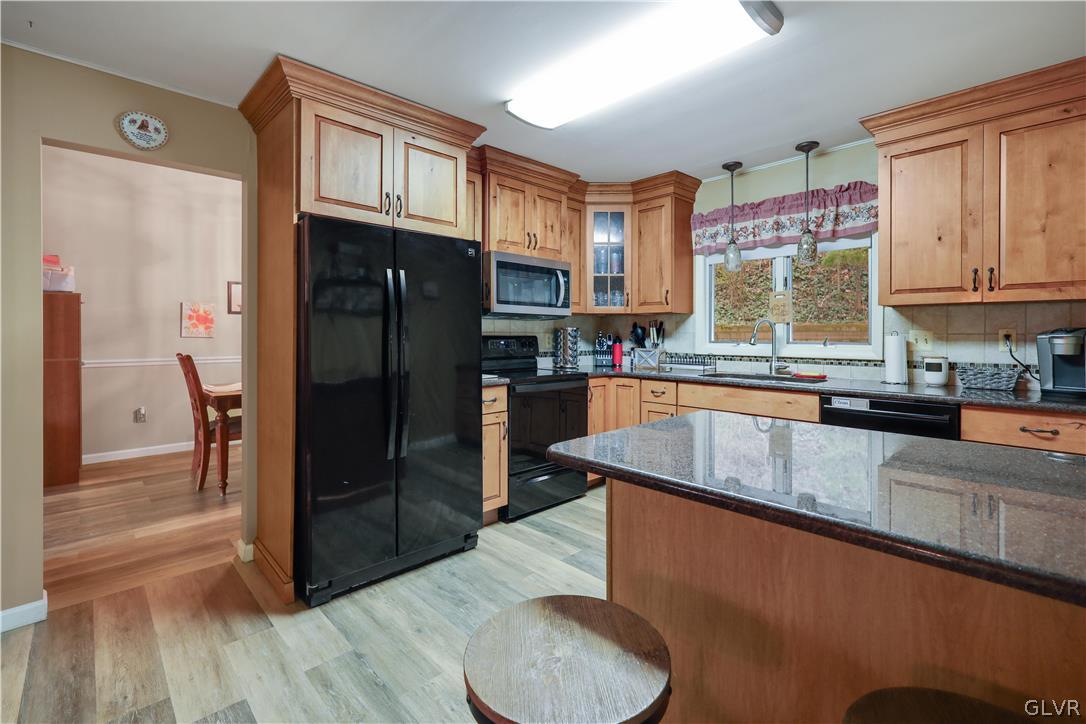 4585 Maple Drive Walnutport, PA 18088 - Photo 9 of 36 a kitchen with stainless steel appliances granite countertop a refrigerator and a sink