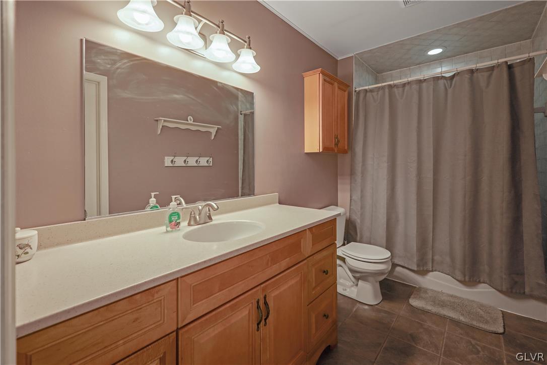 4585 Maple Drive Walnutport, PA 18088 - Photo 10 of 36 a bathroom with a sink a toilet and mirror