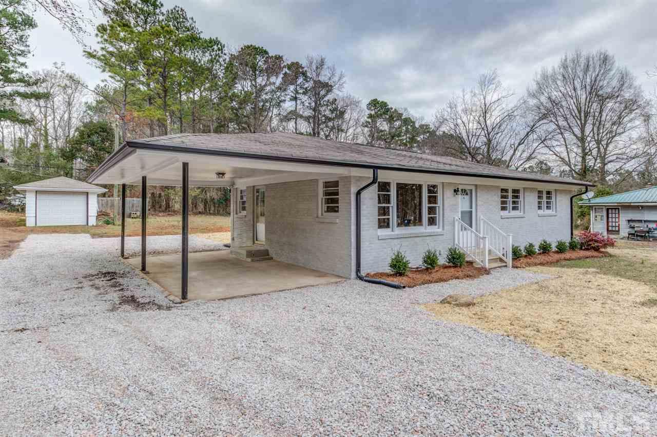 309 Creech Road Garner, NC 27529 - Photo 3 of 30 front view of a house with a patio