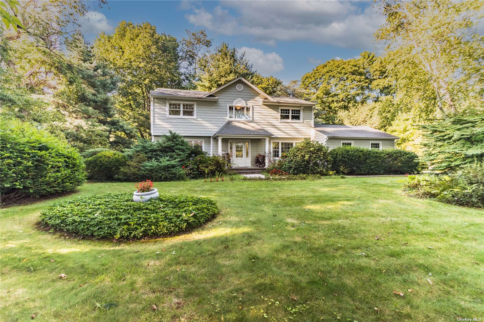 33 West Maple Road Greenlawn, NY 11740 - Photo 1 of 1 a front view of a house with a yard
