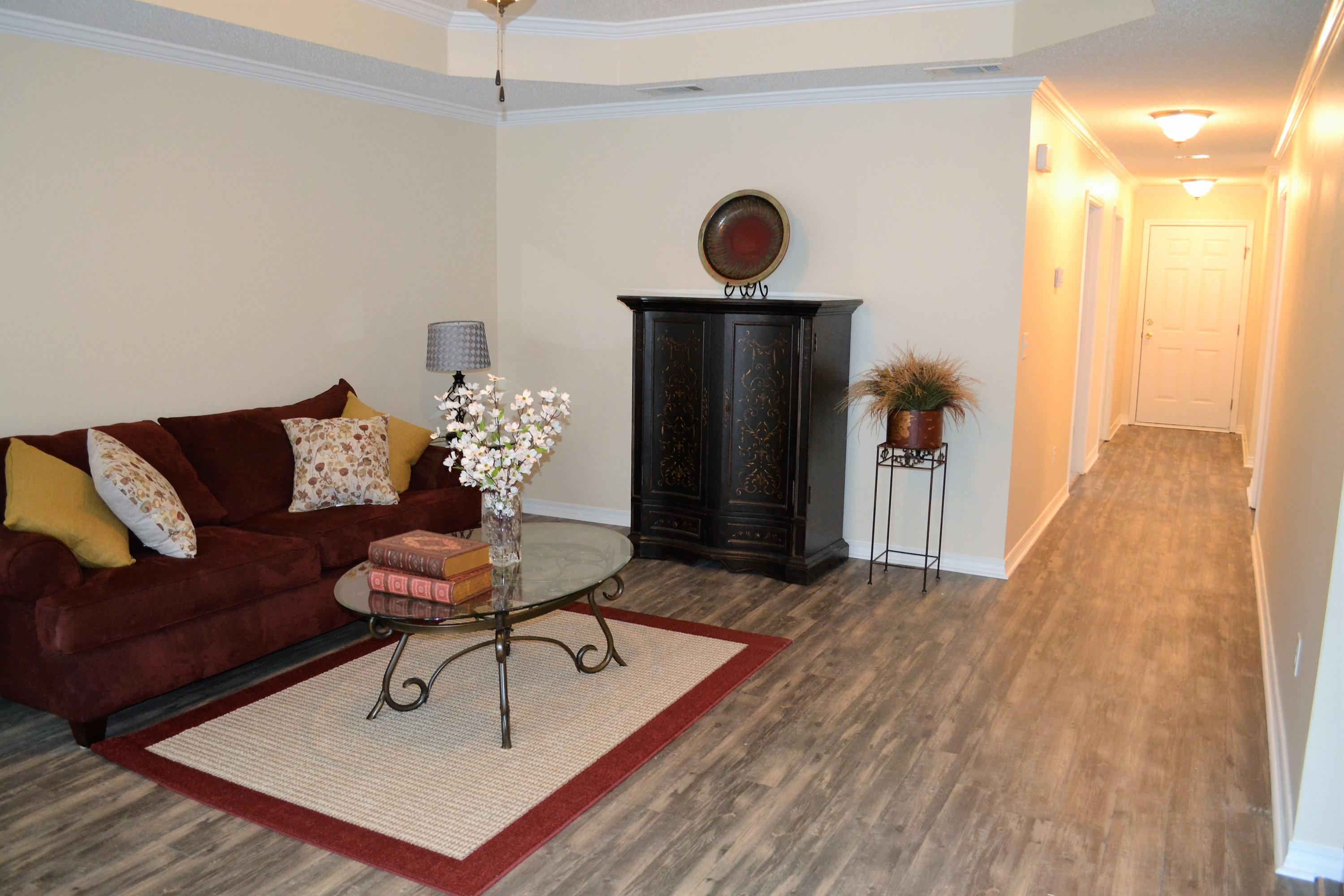5237 Kervin Road Crestview, FL 32539 - Photo 2 of 28 a living room with furniture and a wooden floor
