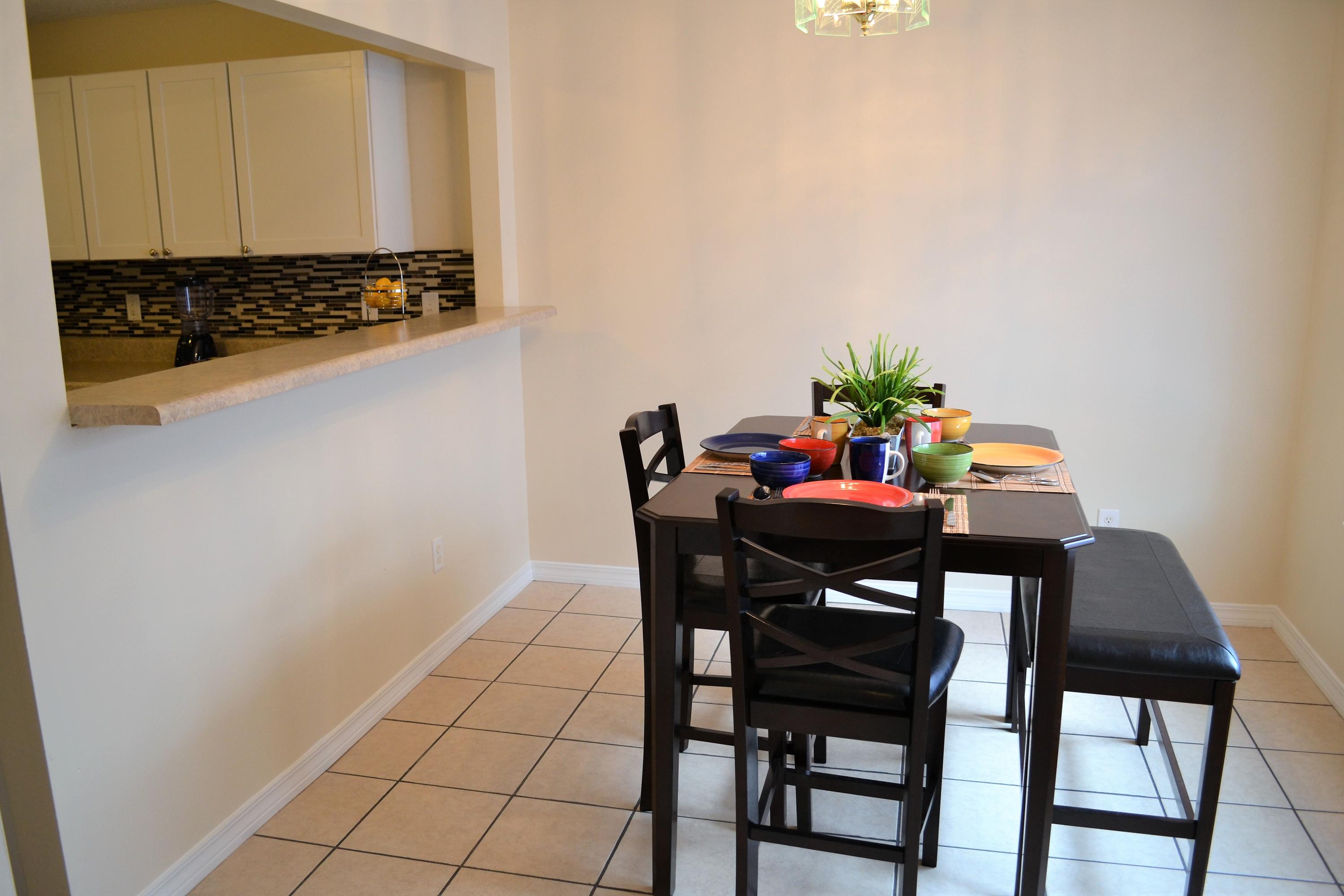 5237 Kervin Road Crestview, FL 32539 - Photo 11 of 28 a view of a dining room with furniture and wooden floor