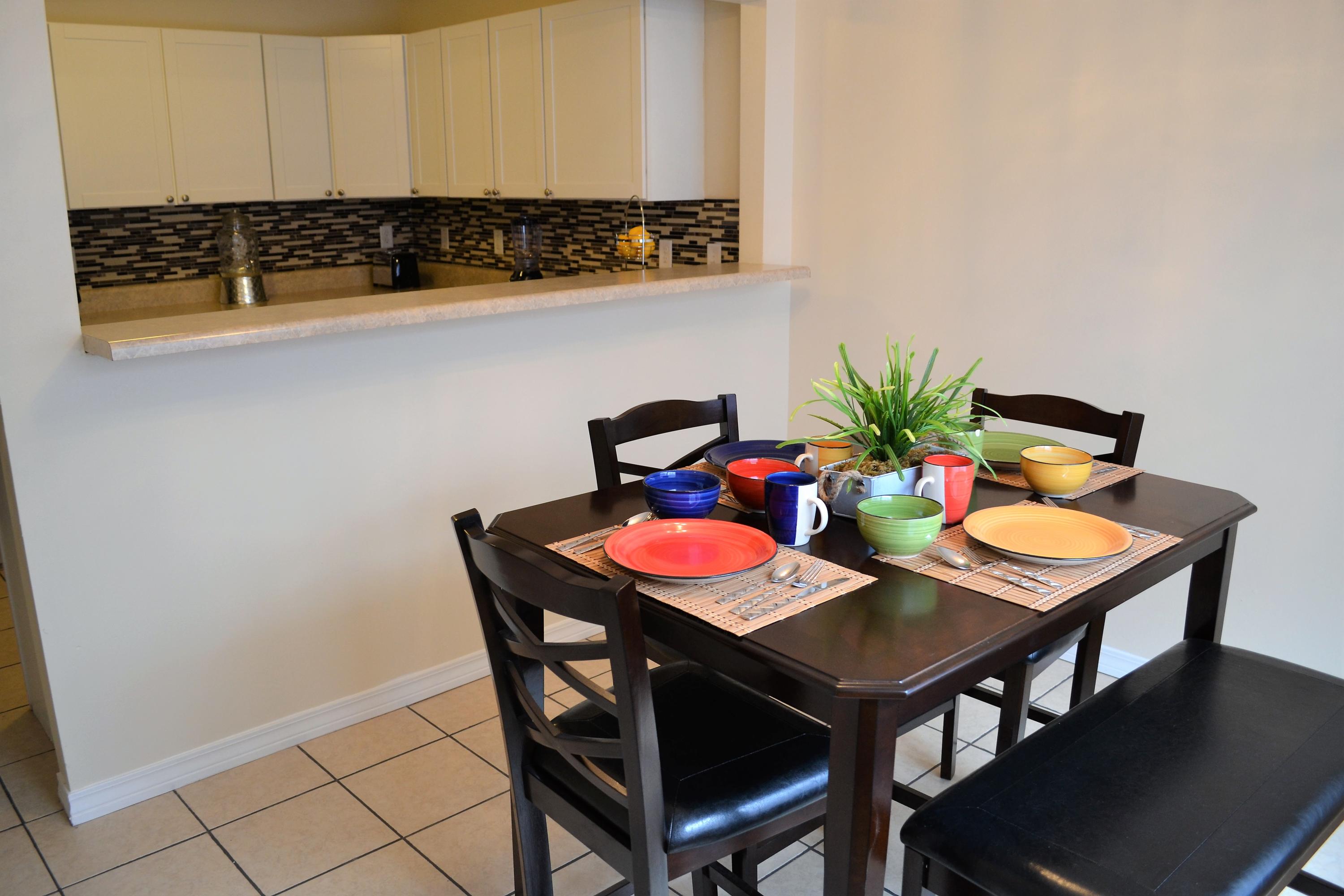5237 Kervin Road Crestview, FL 32539 - Photo 12 of 28 a table and chairs in a kitchen