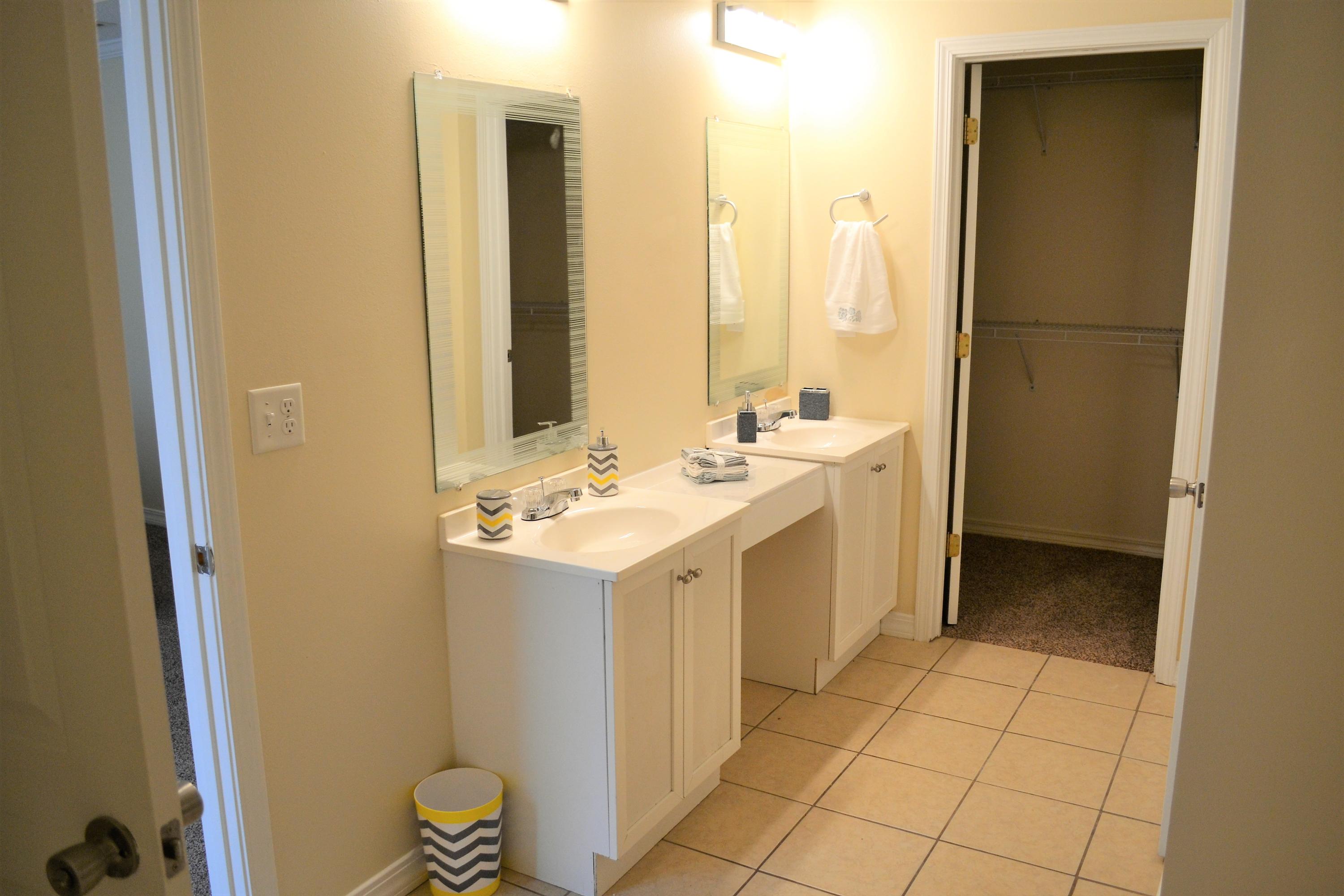 5237 Kervin Road Crestview, FL 32539 - Photo 19 of 28 a view of bathroom with a sink and mirror