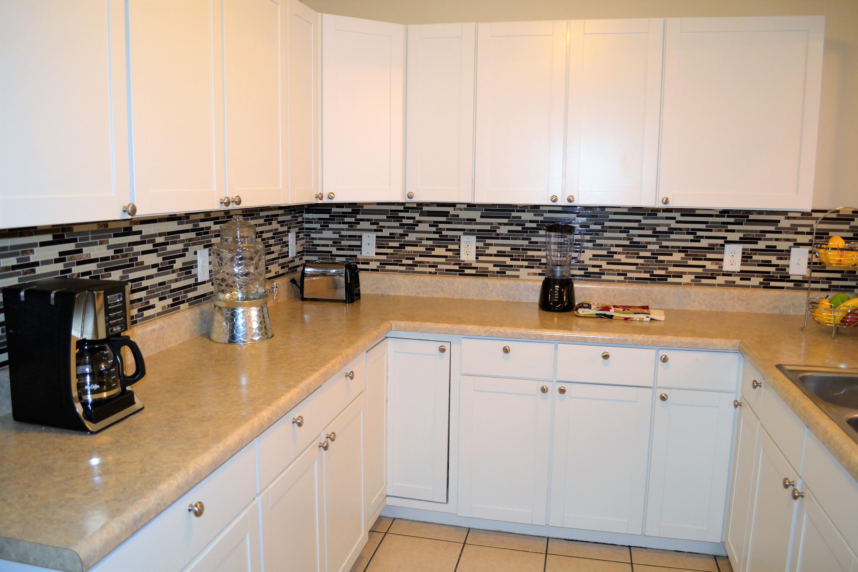 5237 Kervin Road Crestview, FL 32539 - Photo 9 of 28 a kitchen with a sink and cabinets