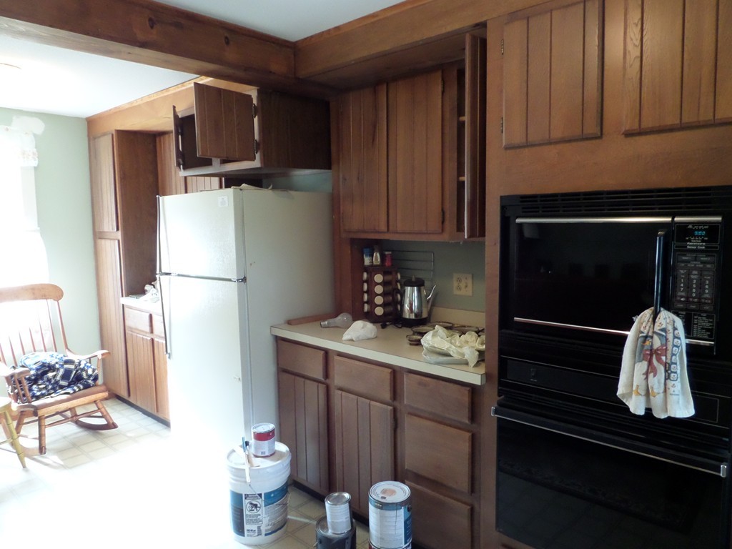 15 Bromley Road Huntington, MA 01050 - Photo 15 of 29 a kitchen with a refrigerator and a stove