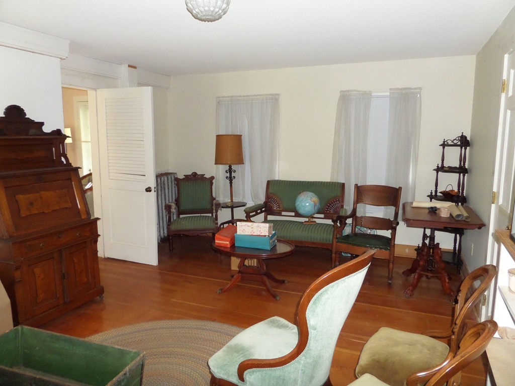 15 Bromley Road Huntington, MA 01050 - Photo 17 of 29 a living room with furniture and a fireplace