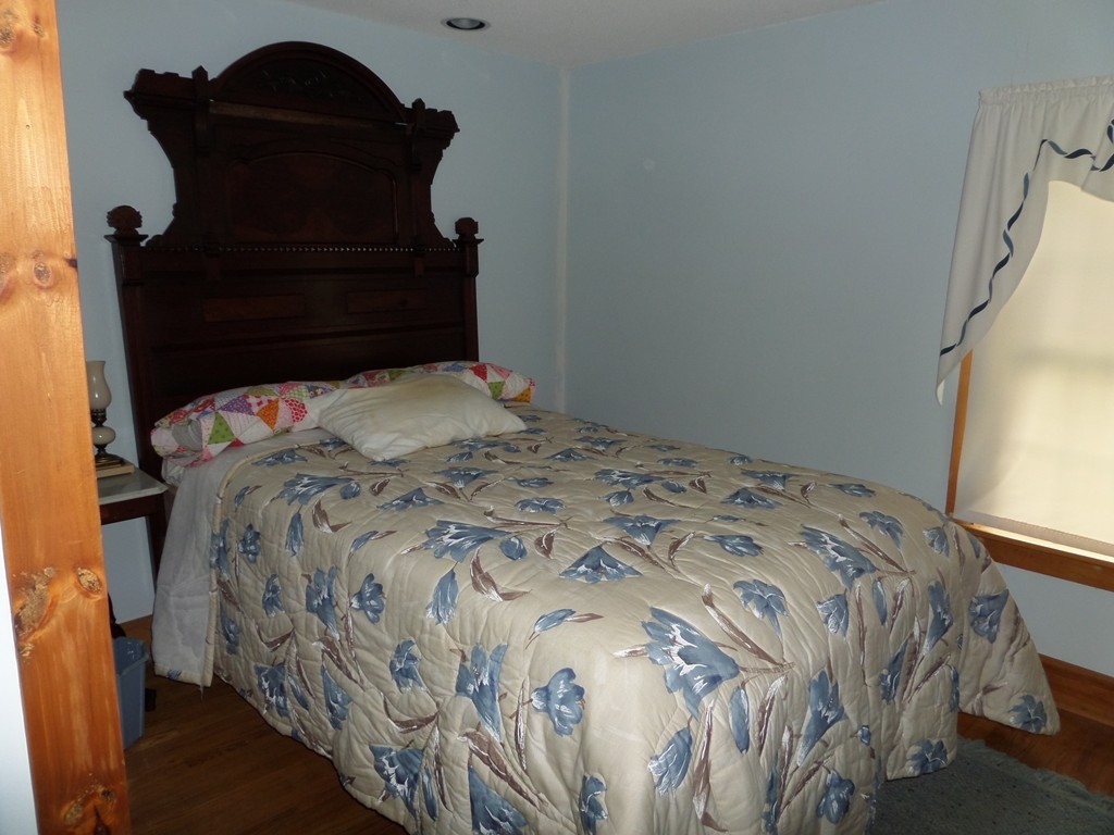 15 Bromley Road Huntington, MA 01050 - Photo 19 of 29 a bedroom with a bed and a window