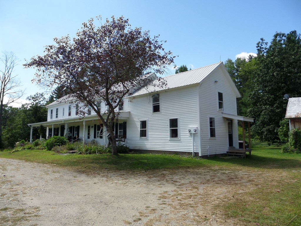 15 Bromley Road Huntington, MA 01050 - Photo 4 of 29 a front view of a house with a garden