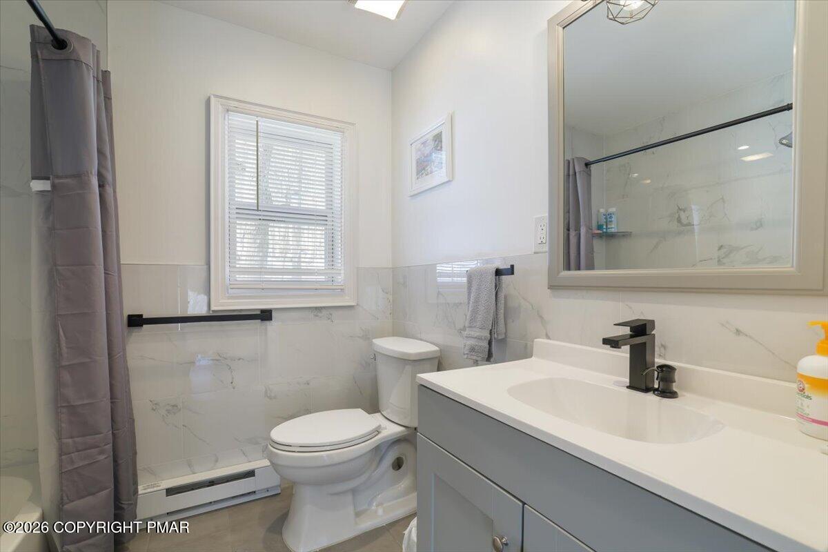 5873 Decker Road Bushkill, PA 18324 - Photo 20 of 57 a bathroom with a sink a toilet and shower