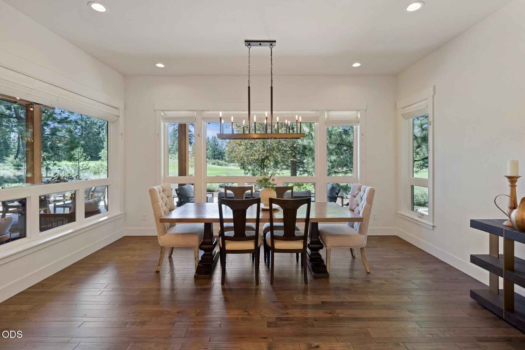 60255 Sunset View Drive Bend, OR 97702 - Photo 15 of 48 a dining room with furniture window wooden floor