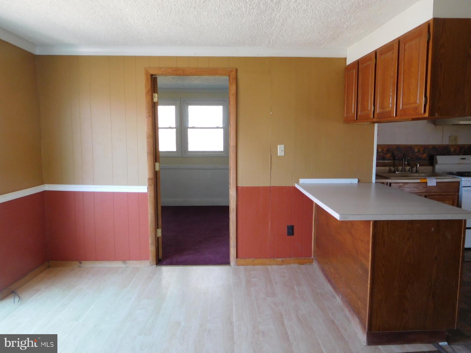 2201 Pondtown Road Chestertown, MD 21620 - Photo 4 of 9 a kitchen with wooden cabinets