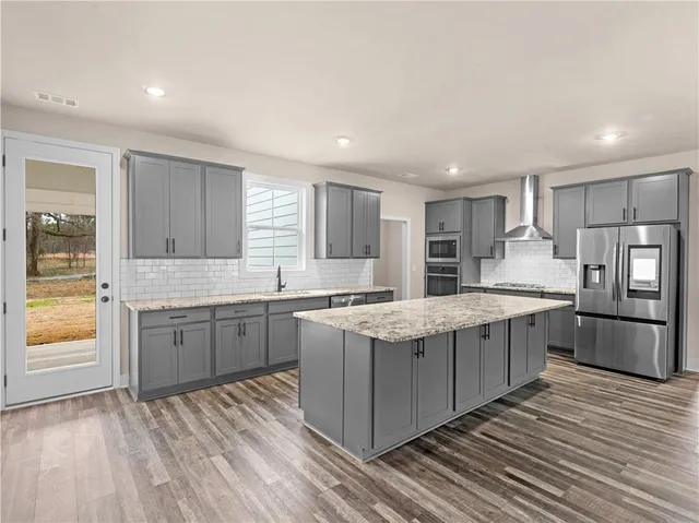 a kitchen with granite countertop counter top space sink and stainless steel appliances