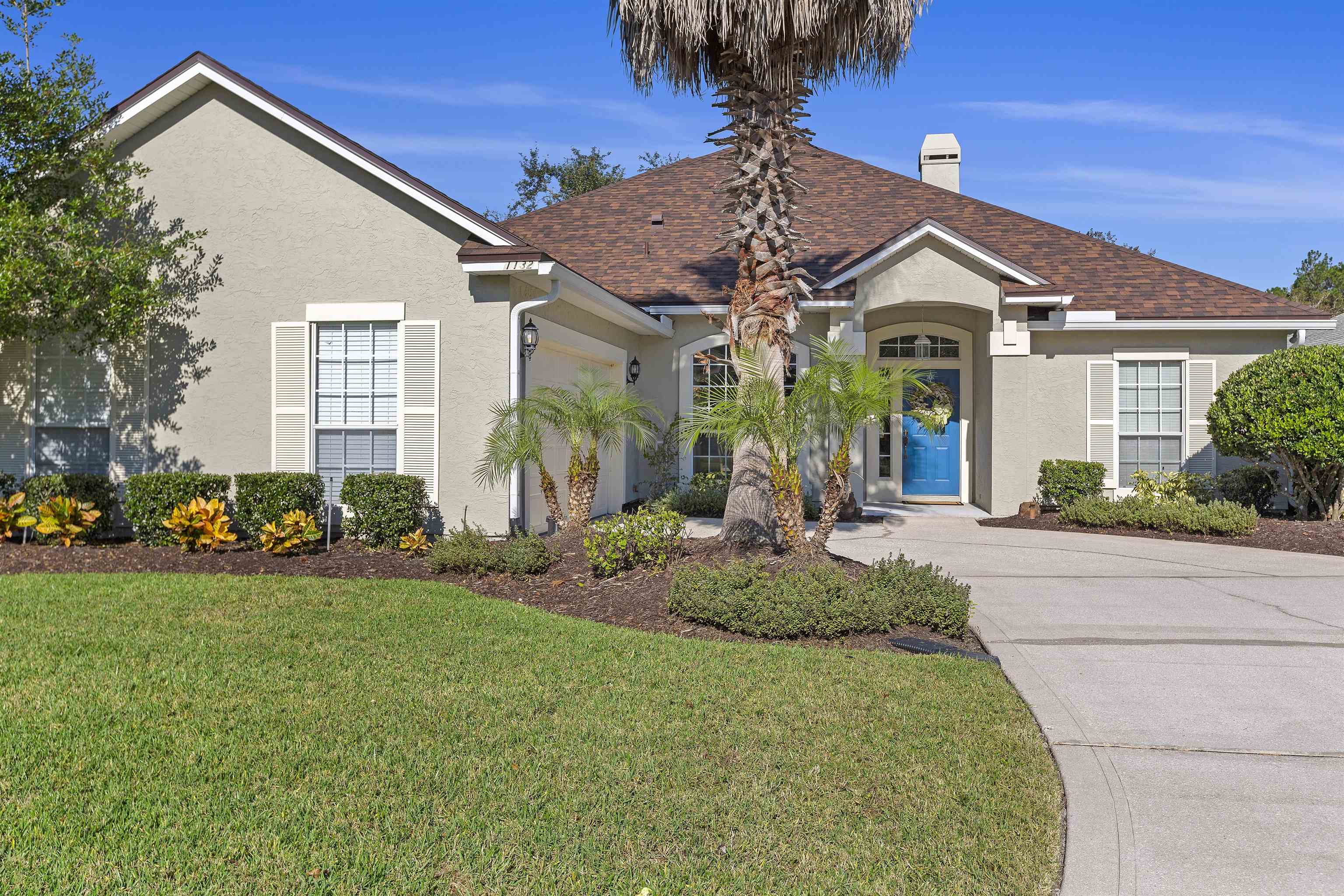 1132 Sandlake Road St. Augustine, FL 32092 - Photo 3 of 49 a front view of a house with garden