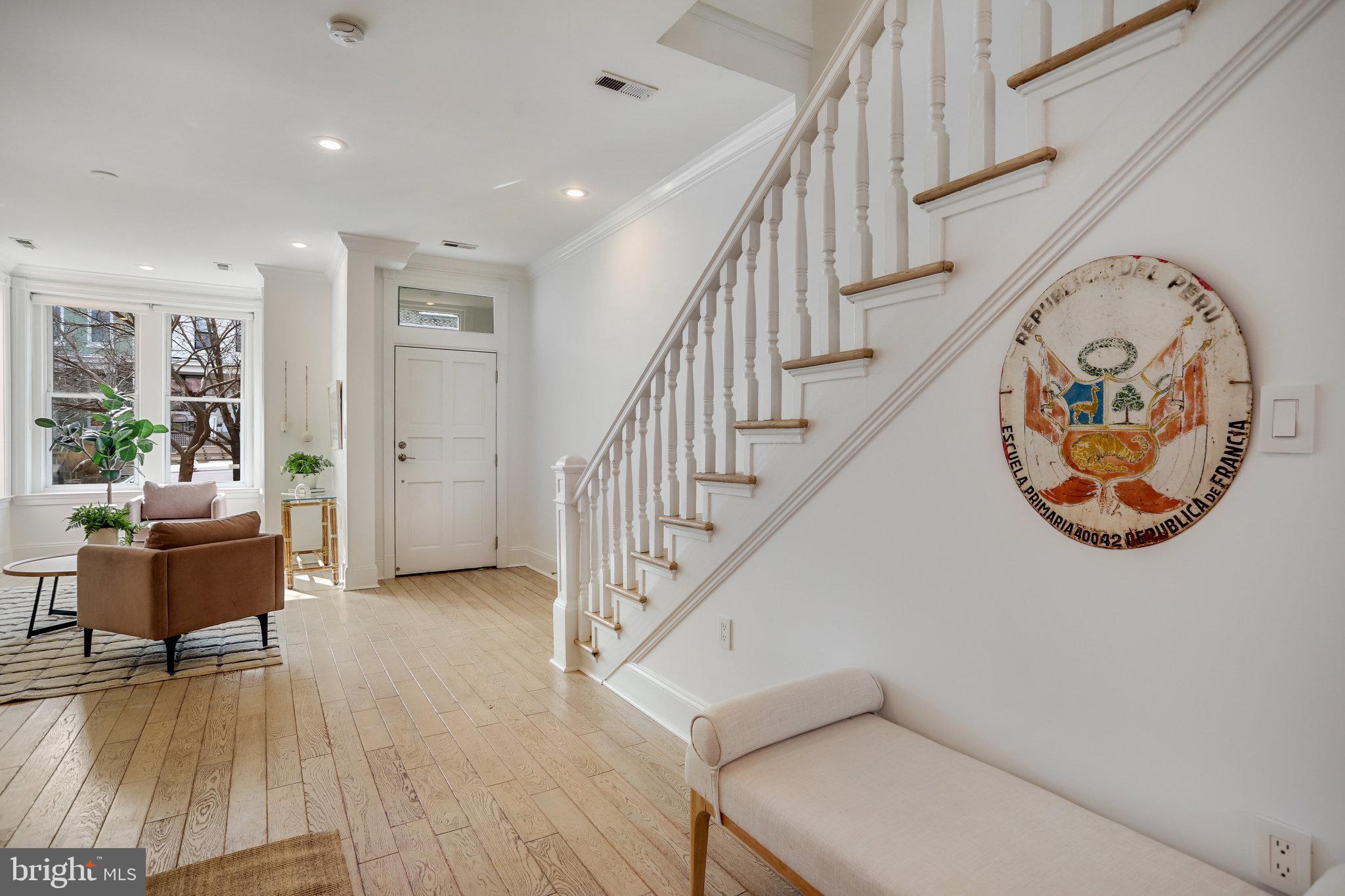 1322 E Street Northeast Washington, DC 20002 - Photo 13 of 49 a view of staircase with furniture and a chandelier