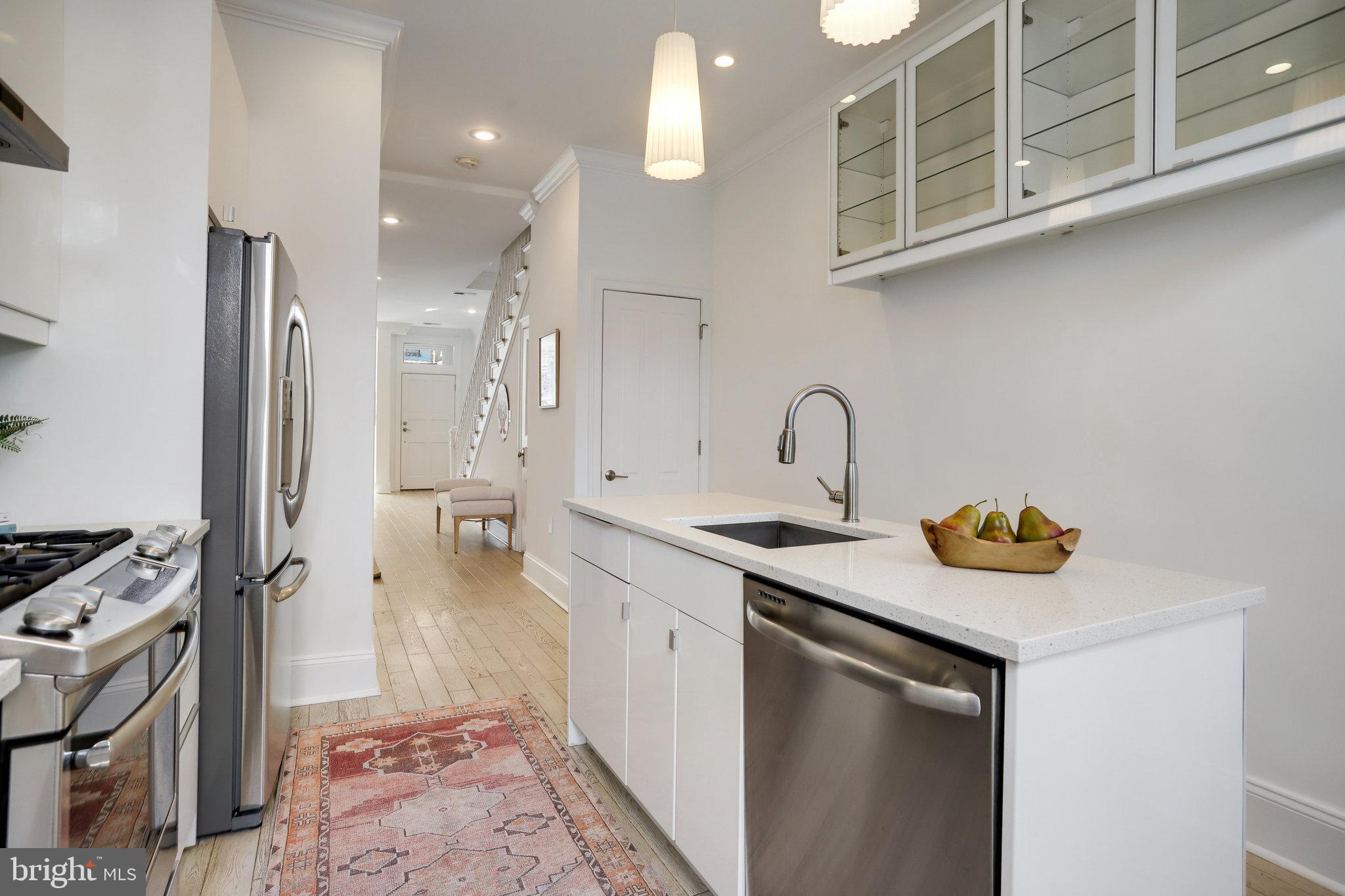 1322 E Street Northeast Washington, DC 20002 - Photo 17 of 49 a bathroom with a sink a vanity and a mirror