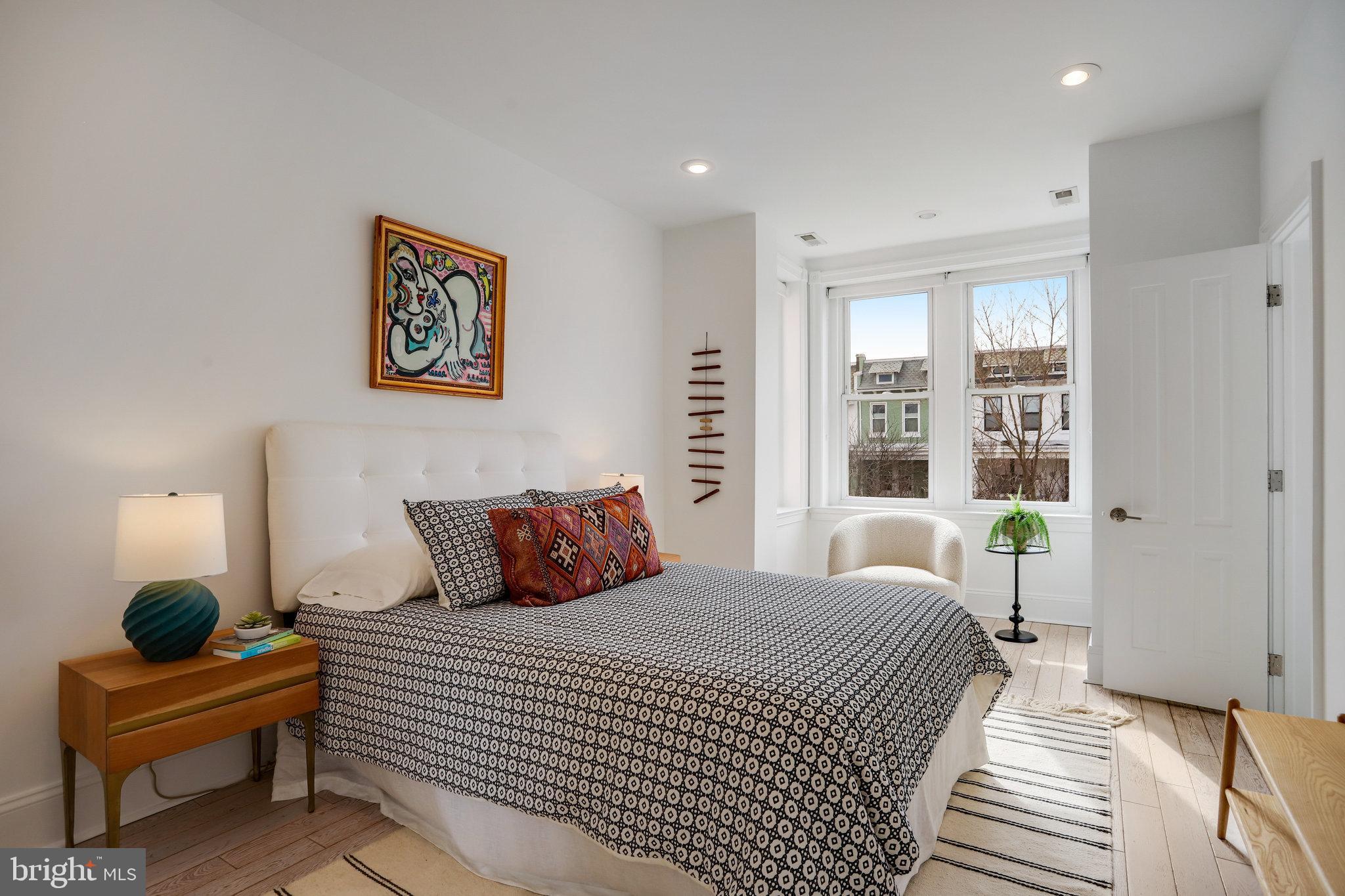 1322 E Street Northeast Washington, DC 20002 - Photo 23 of 49 a bedroom with a bed and a large window