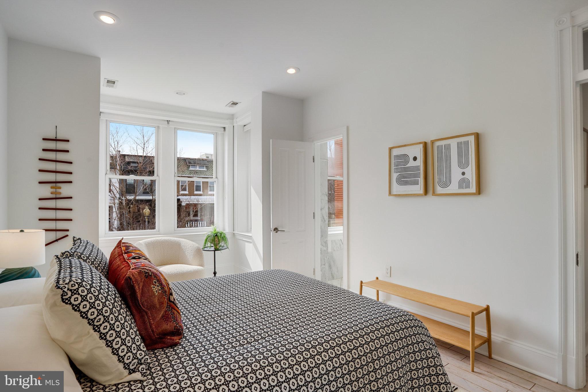 1322 E Street Northeast Washington, DC 20002 - Photo 24 of 49 a bedroom with furniture and a window