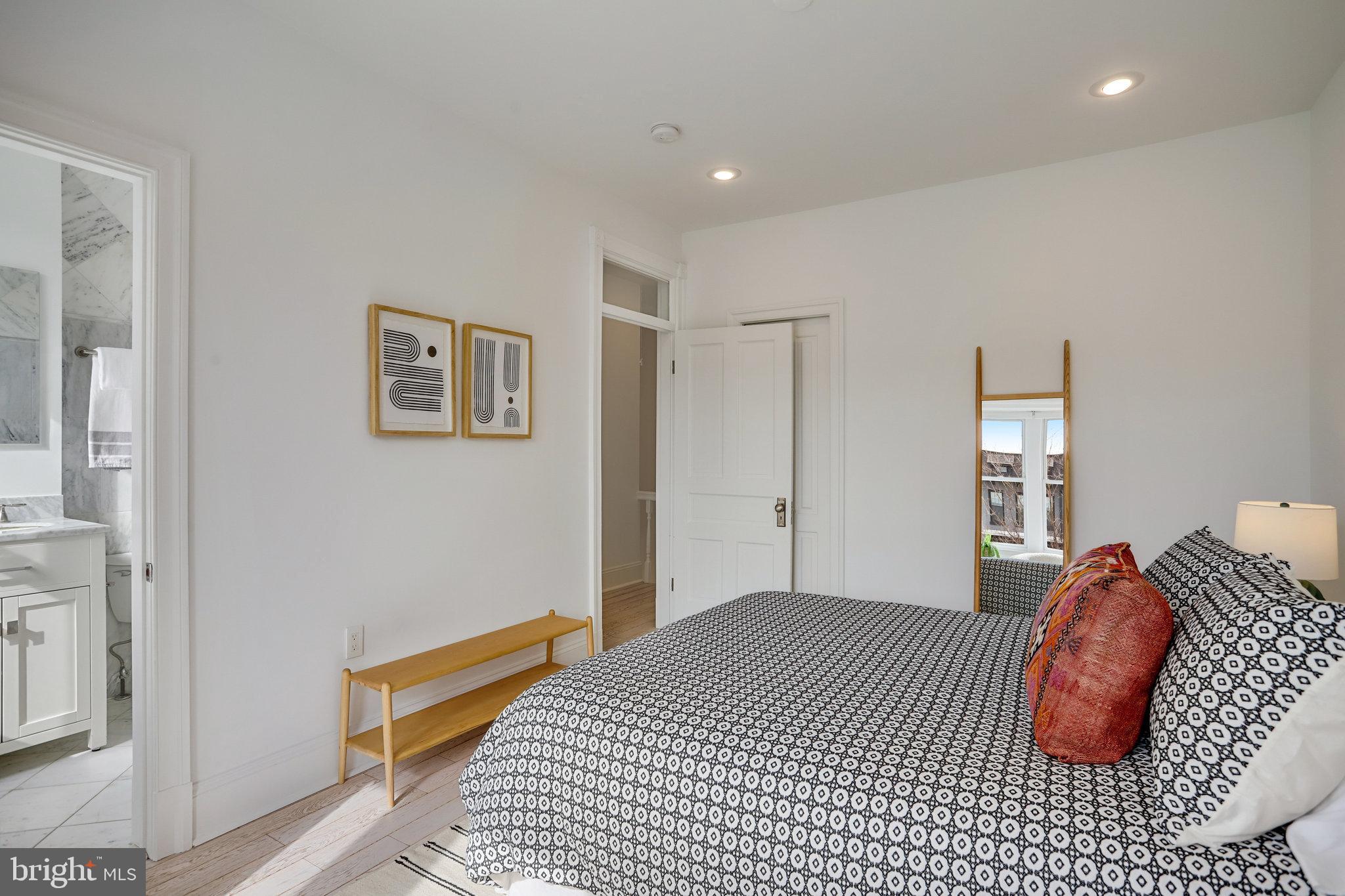 1322 E Street Northeast Washington, DC 20002 - Photo 25 of 49 a bedroom with bed and a window