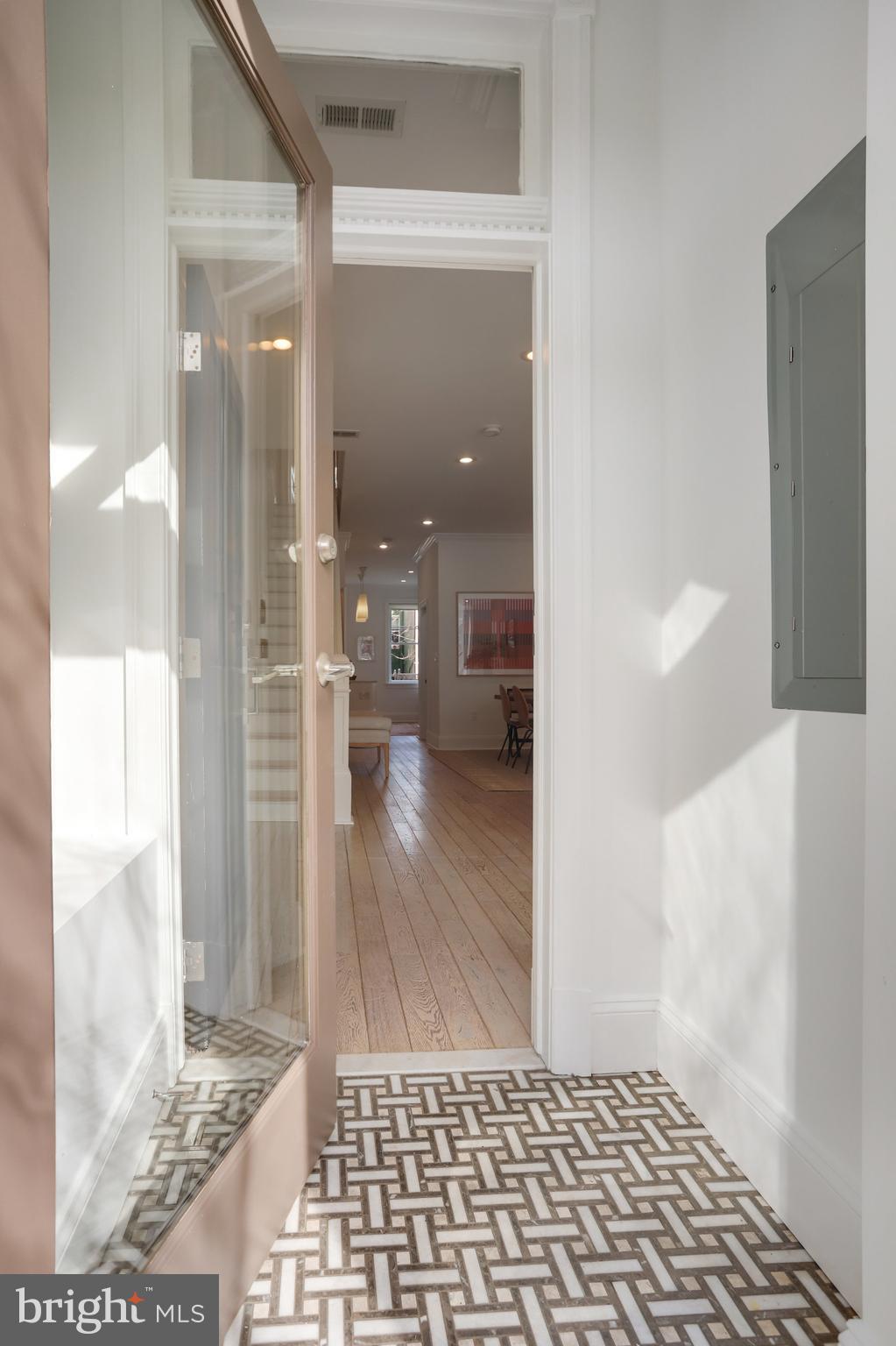 1322 E Street Northeast Washington, DC 20002 - Photo 3 of 49 a view of a hallway with wooden floor windows and a living room