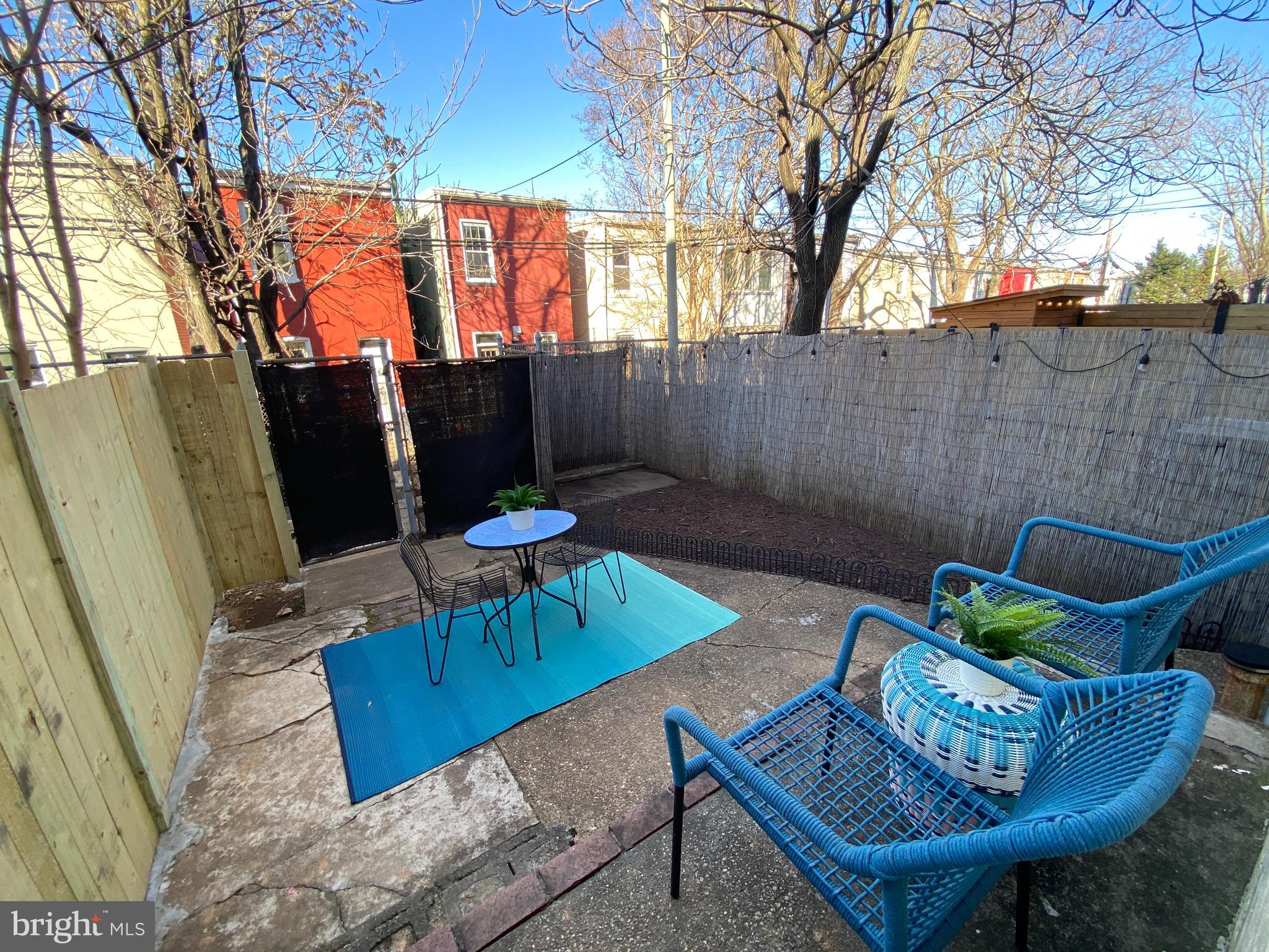 1322 E Street Northeast Washington, DC 20002 - Photo 41 of 49 a view of a backyard with furniture and a fire pit