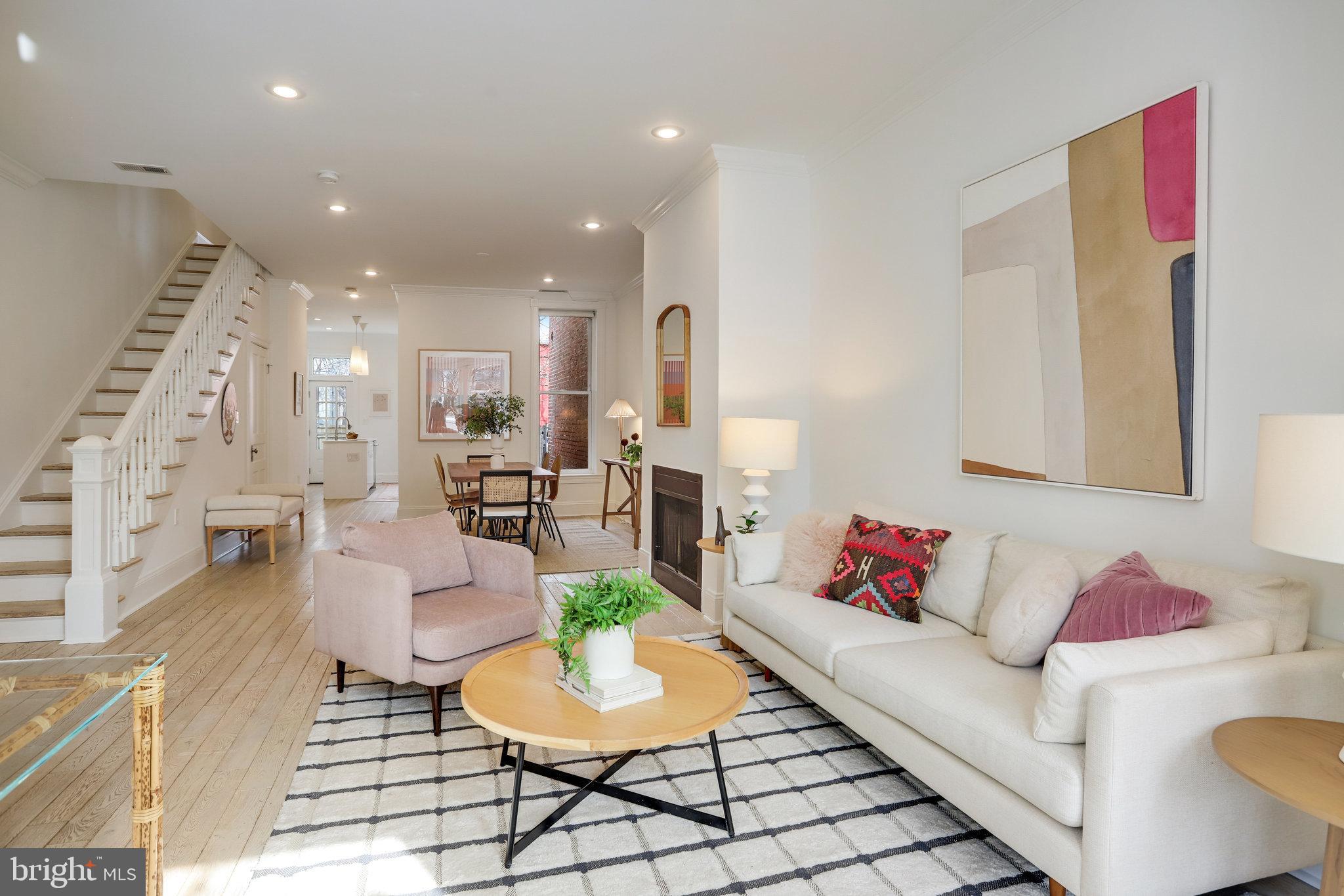 1322 E Street Northeast Washington, DC 20002 - Photo 6 of 49 a living room with furniture and a dining table with kitchen view