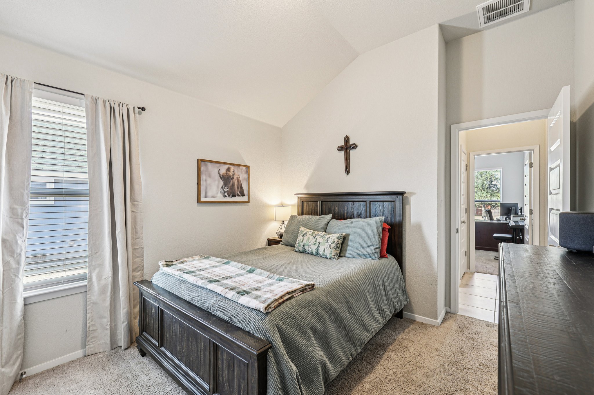 111 Insider Loop Elgin, TX 78621 - Photo 21 of 39 a bedroom with a bed and a table