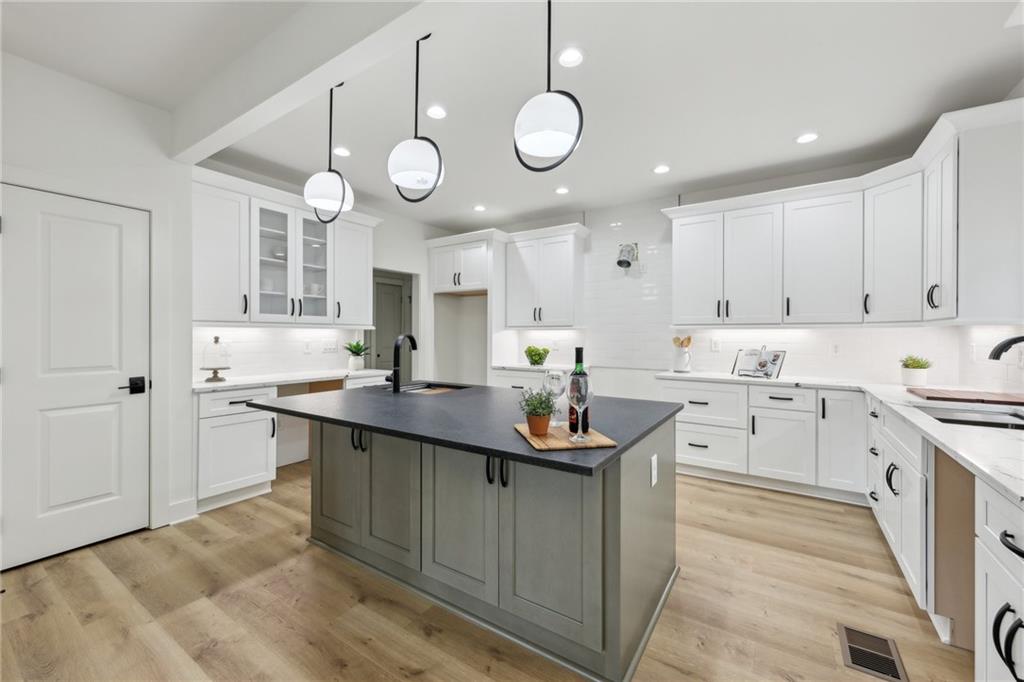 727 Garibaldi Street Southwest Atlanta, GA 30310 - Photo 12 of 84 a kitchen with cabinets a sink and stainless steel appliances