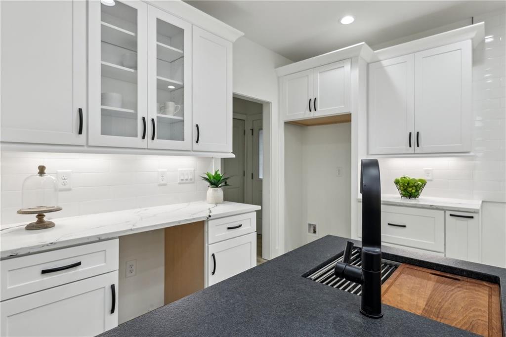 727 Garibaldi Street Southwest Atlanta, GA 30310 - Photo 15 of 84 a kitchen with a refrigerator and a sink