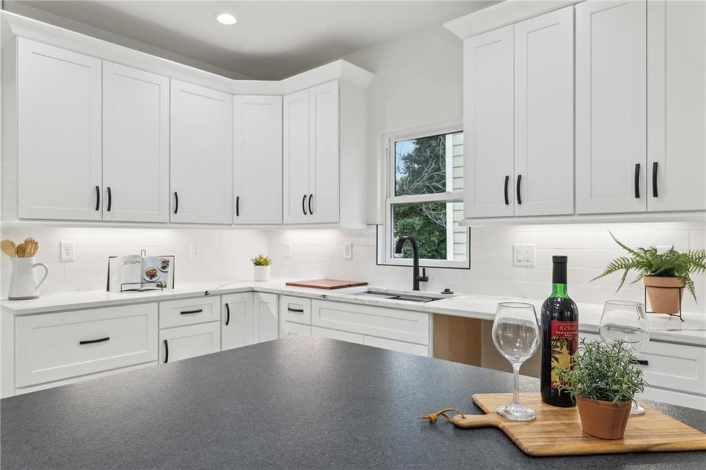 727 Garibaldi Street Southwest Atlanta, GA 30310 - Photo 16 of 84 a kitchen with a sink cabinets and window