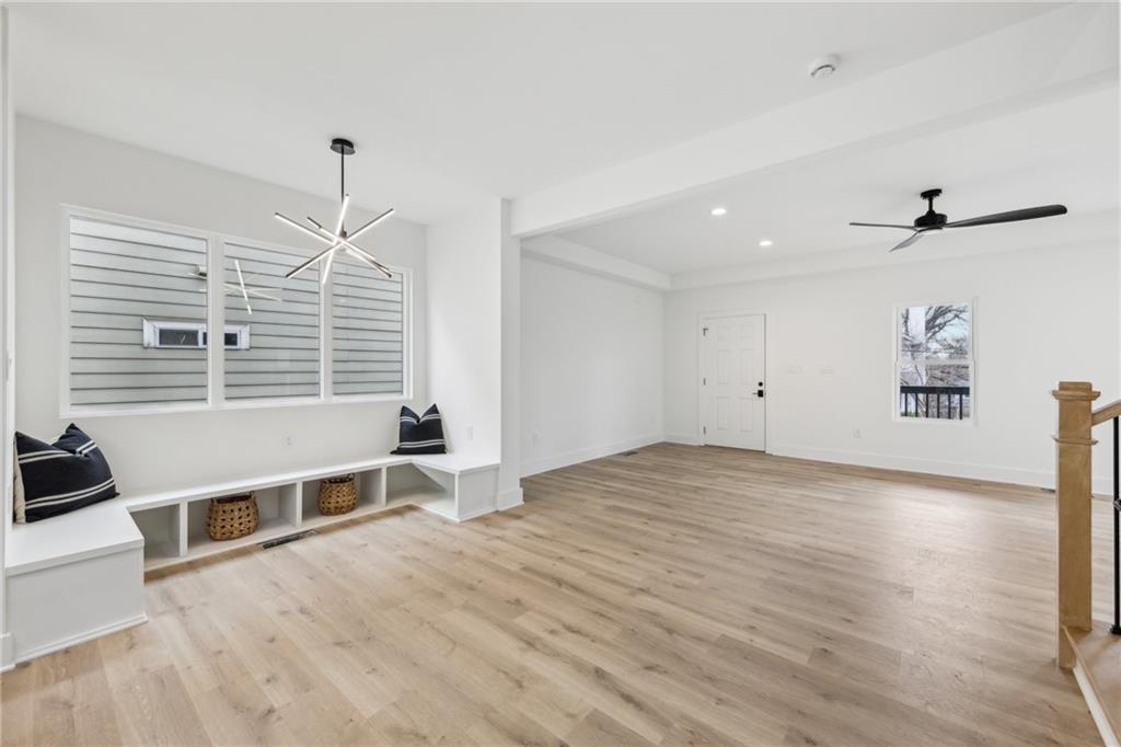 727 Garibaldi Street Southwest Atlanta, GA 30310 - Photo 21 of 84 a view of an empty room with a window and wooden floor