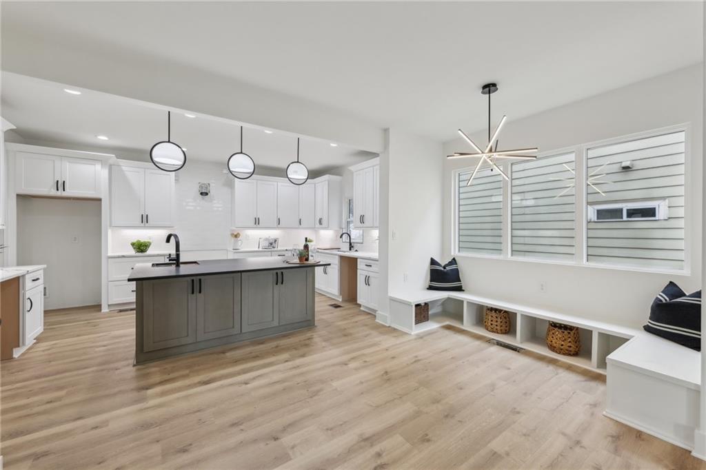727 Garibaldi Street Southwest Atlanta, GA 30310 - Photo 22 of 84 a large kitchen with a large counter space a sink appliances and cabinets