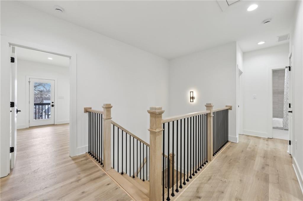 727 Garibaldi Street Southwest Atlanta, GA 30310 - Photo 27 of 84 a view of a hallway with wooden floor and windows