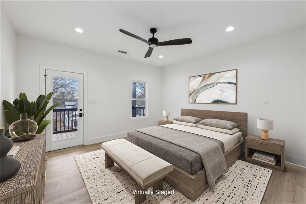 727 Garibaldi Street Southwest Atlanta, GA 30310 - Photo 28 of 84 a bedroom with a bed and a potted plant