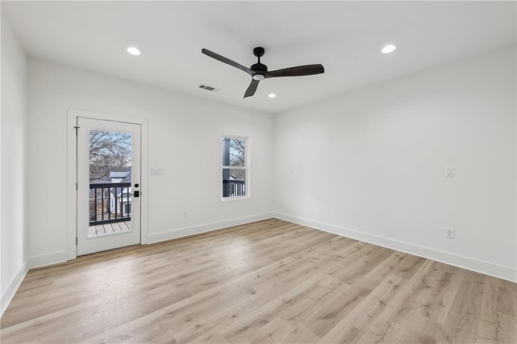 727 Garibaldi Street Southwest Atlanta, GA 30310 - Photo 29 of 84 wooden floor in an empty room with a window