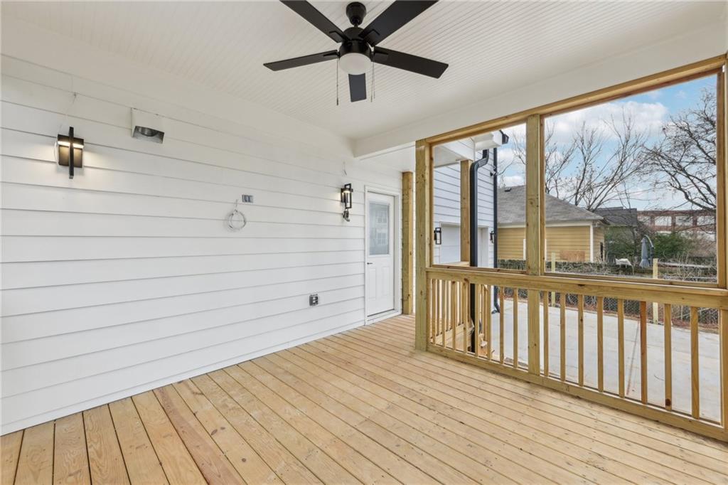 727 Garibaldi Street Southwest Atlanta, GA 30310 - Photo 51 of 84 a view of a porch with wooden floor and a ceiling fan