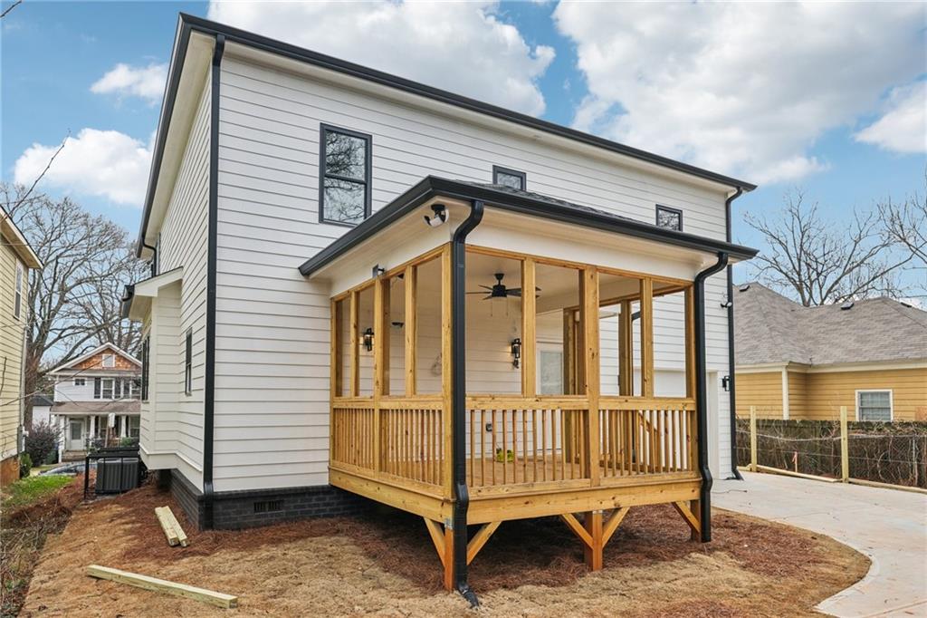 727 Garibaldi Street Southwest Atlanta, GA 30310 - Photo 62 of 84 a view of a house with wooden deck and furniture