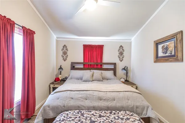 a bedroom with a large bed and a closet