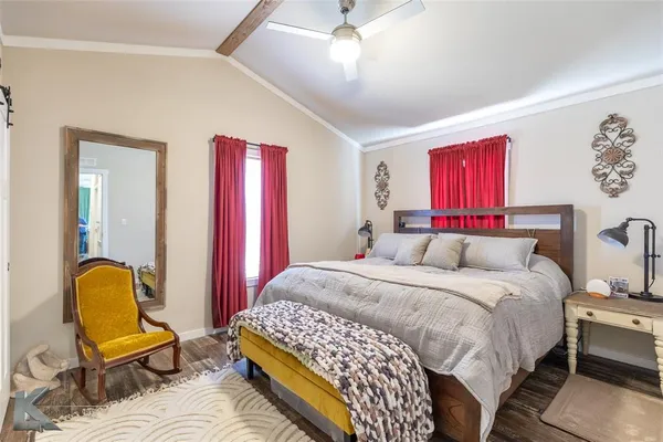 a bedroom with a bed chair and couch