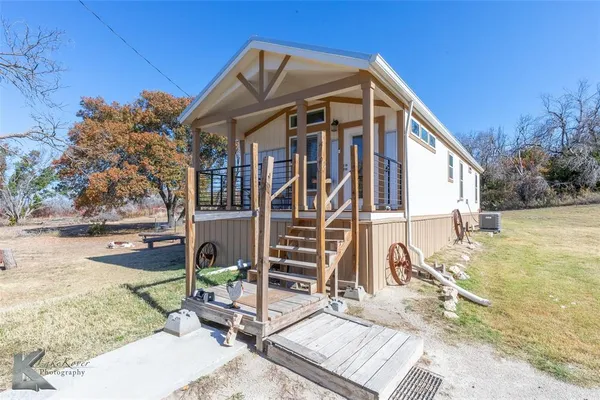 a view of a house with wooden deck
