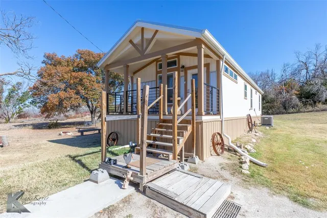 a view of a house with wooden deck