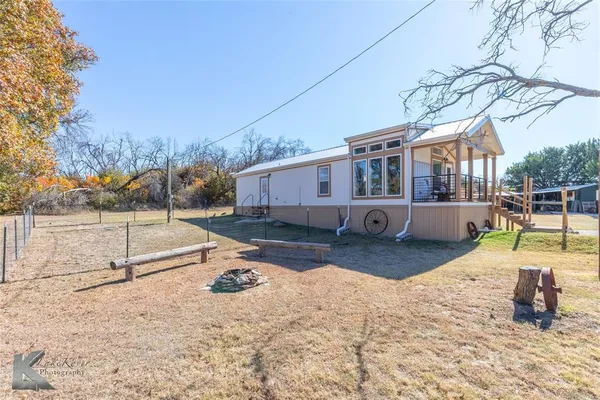 a view of a backyard with a patio