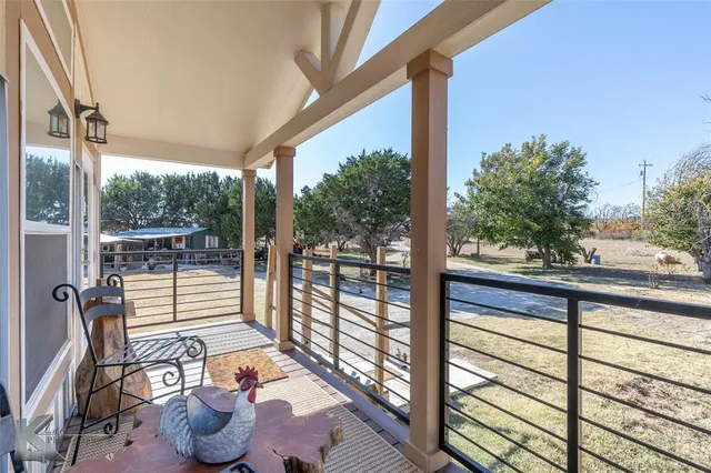 a view of a floor to ceiling window with wooden floor
