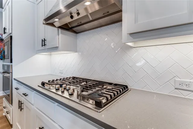 a kitchen with a stove and a microwave