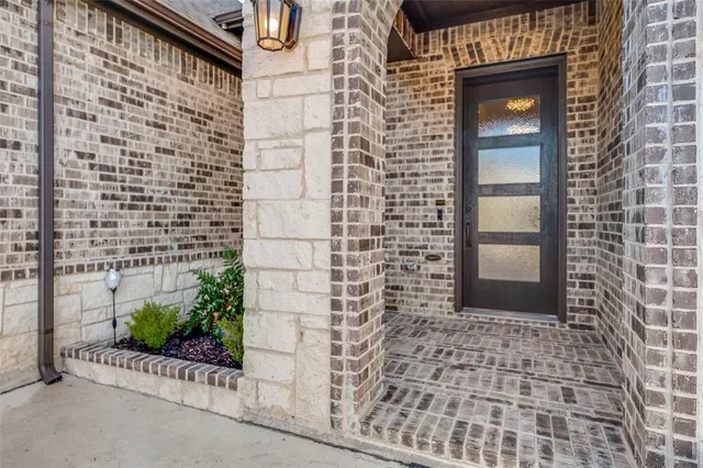 a bathroom with a shower and a sink