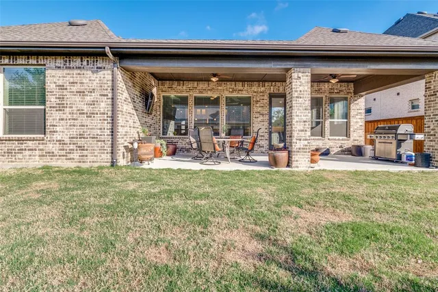 a front view of a house with outdoor seating