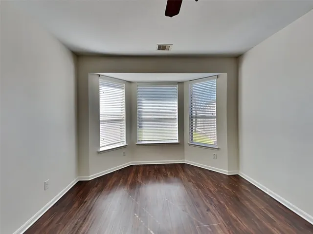 a bathroom with a shower and a sink